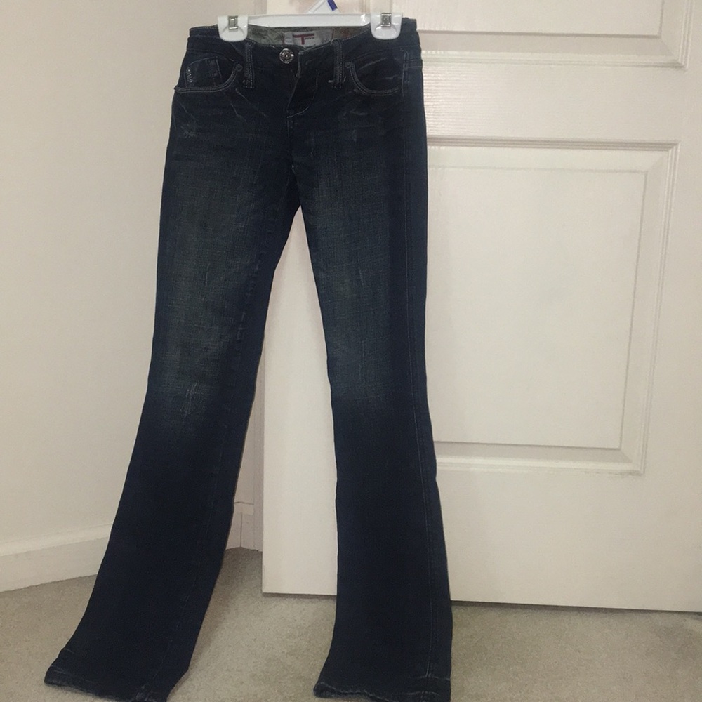 Dark jeans with design on back pockets